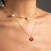 Collier avec pendentif en forme de cœur et clavicule